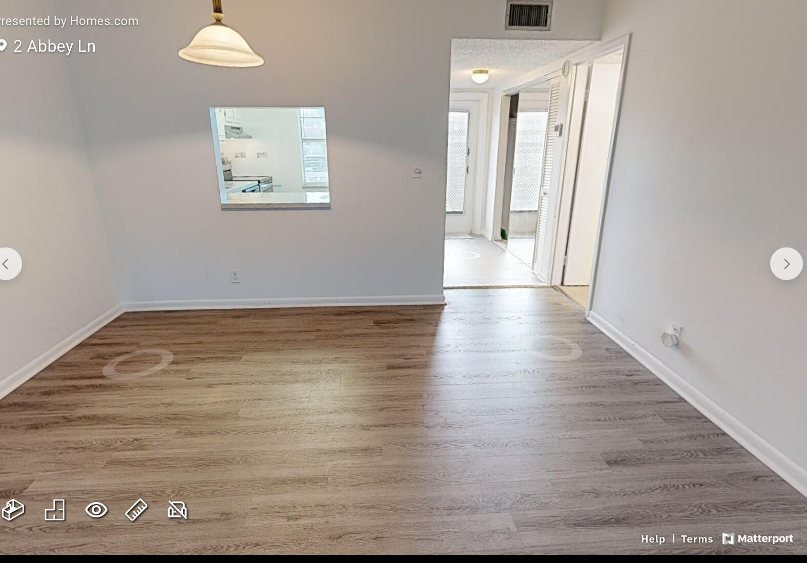 2 2 Abbey Lane, Unit 203 Delray Beach, FL 33446 - Photo 8 of 22 a view of a hallway with wooden floor