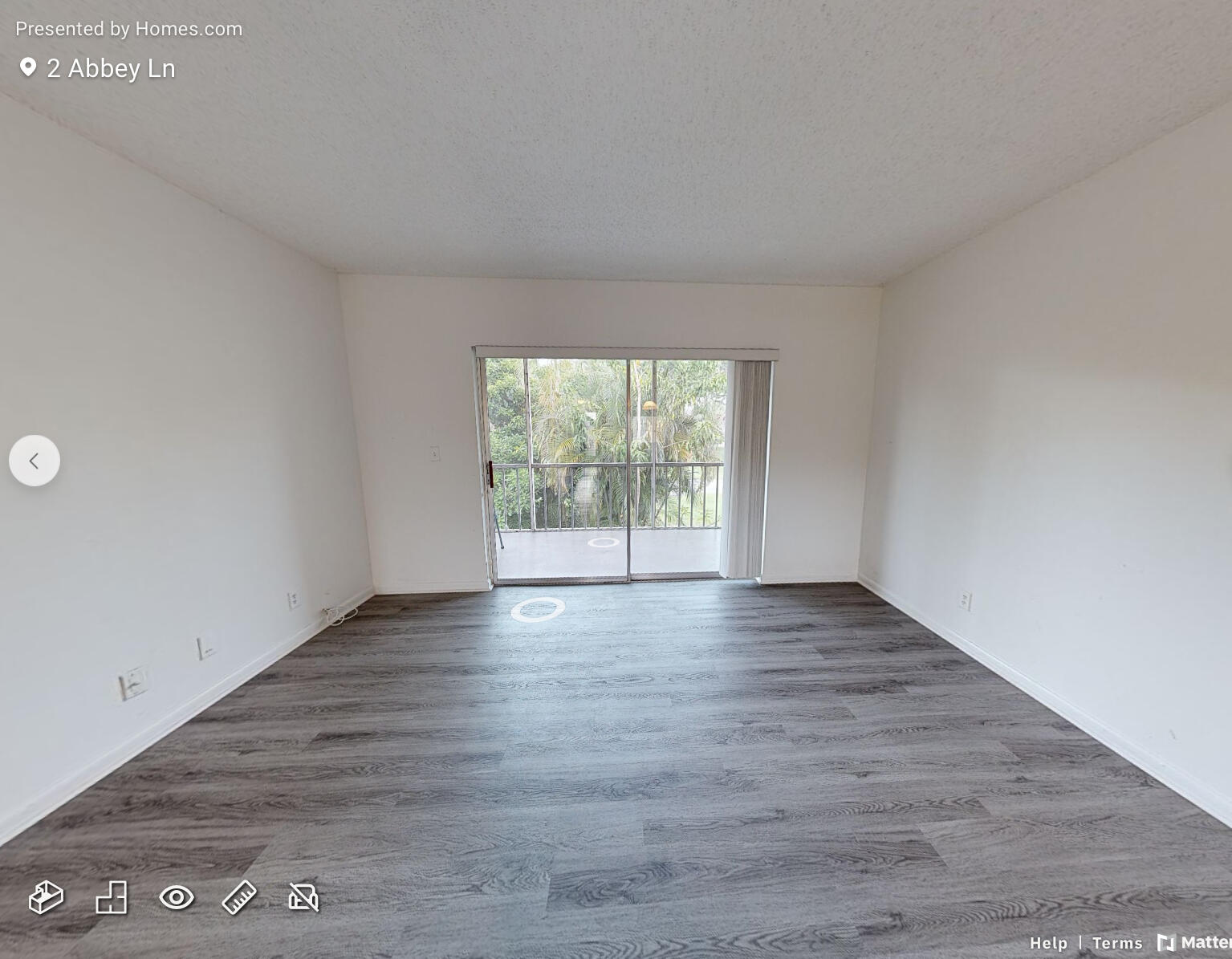 2 2 Abbey Lane, Unit 203 Delray Beach, FL 33446 - Photo 10 of 22 a view of an empty room with wooden floor and a window