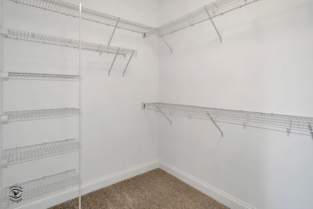 a view of a room with racks on the wall