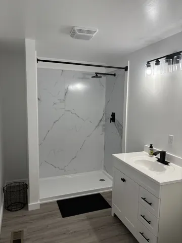a bathroom with a sink and a mirror