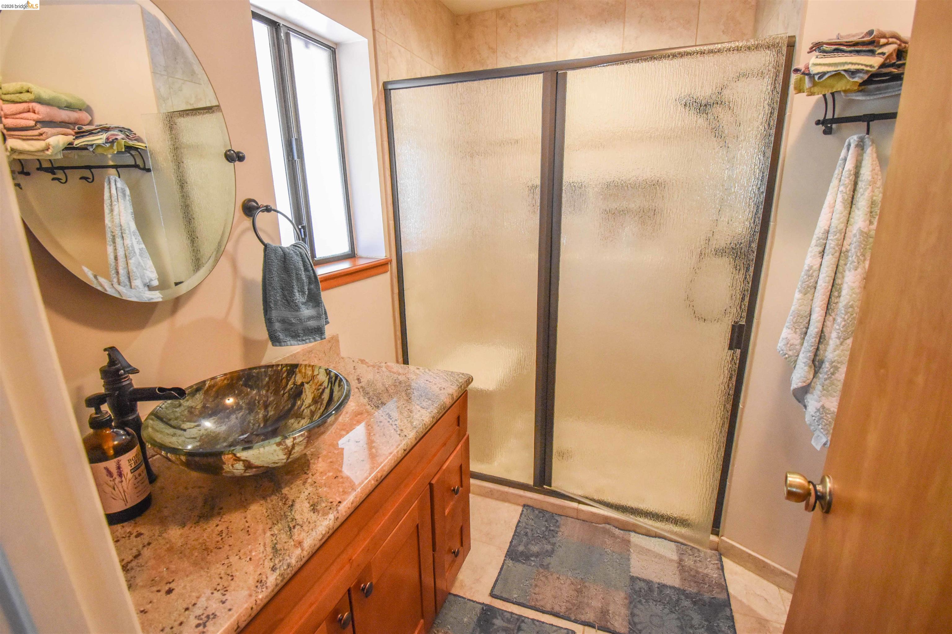 21932 Phoenix Lake Road Sonora, CA 95370 - Photo 24 of 44 Remodeled with granite, tiled shower and flooring which has radiant heat.