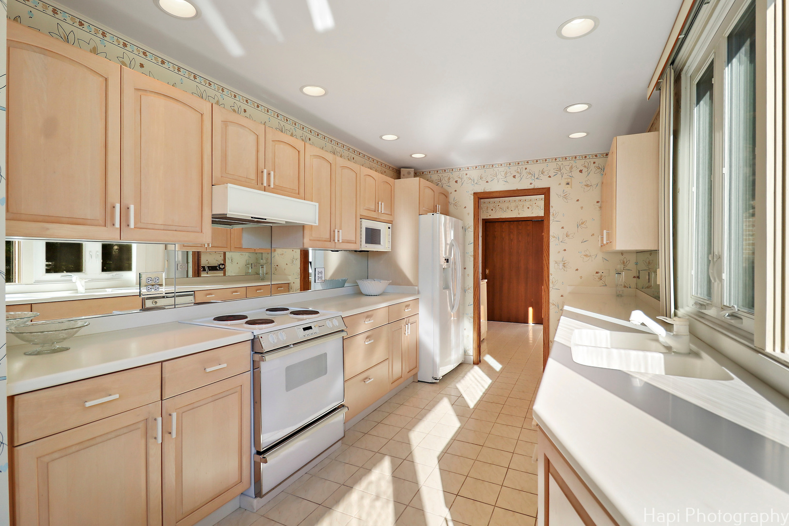 80 Meadow Hill Road Barrington Hills, IL 60010 - Photo 13 of 25 a kitchen with a sink stove and cabinets