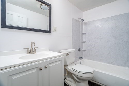 39 Berlin Street, Unit 315 Clinton, MA 01510 - Photo 11 of 22 a bathroom with a sink a toilet and a bathtub