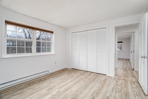 39 Berlin Street, Unit 315 Clinton, MA 01510 - Photo 16 of 22 a view of empty room with wooden floor and fan