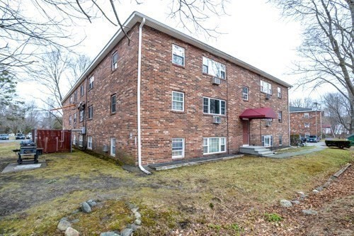 39 Berlin Street, Unit 315 Clinton, MA 01510 - Photo 20 of 22 a view of a house with a yard
