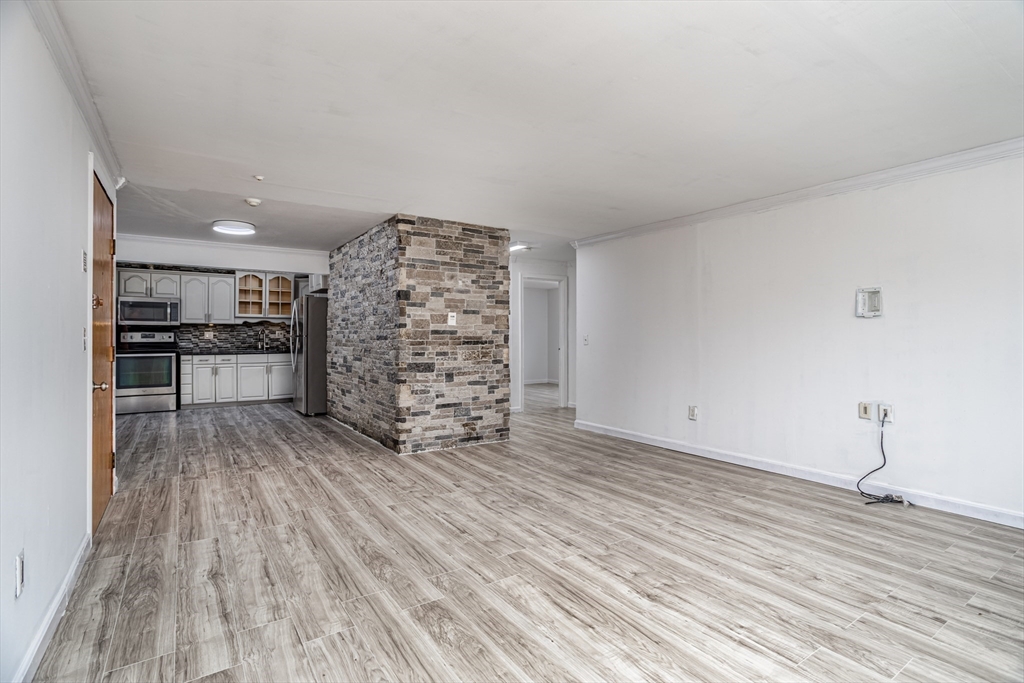 39 Berlin Street, Unit 315 Clinton, MA 01510 - Photo 8 of 22 a view of empty room with wooden floor