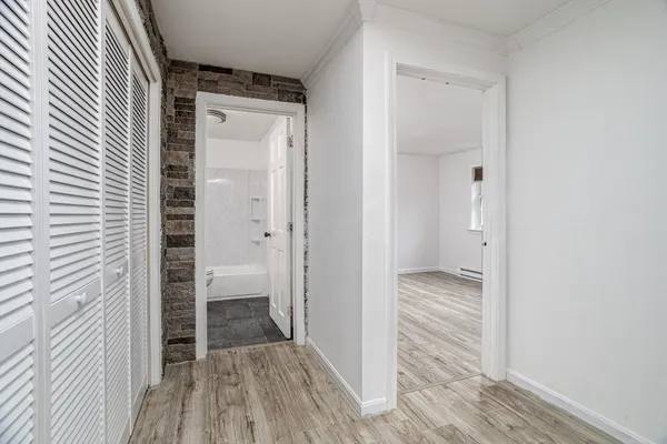 a bathroom with a toilet a sink and a window