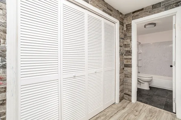 a bathroom with a sink a toilet and a bathtub