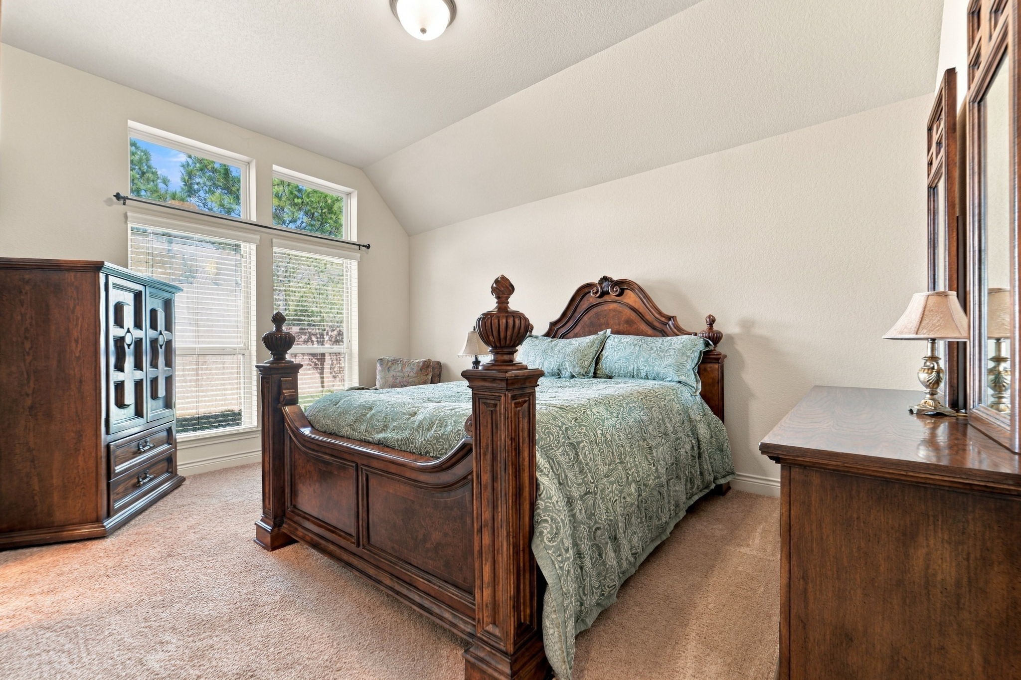 9818 Reston Ranch Court Cypress, TX 77433 - Photo 21 of 38 Flooded with natural light, this secondary bedroom includes soft carpet flooring and a tall ceiling for an open, airy feel.