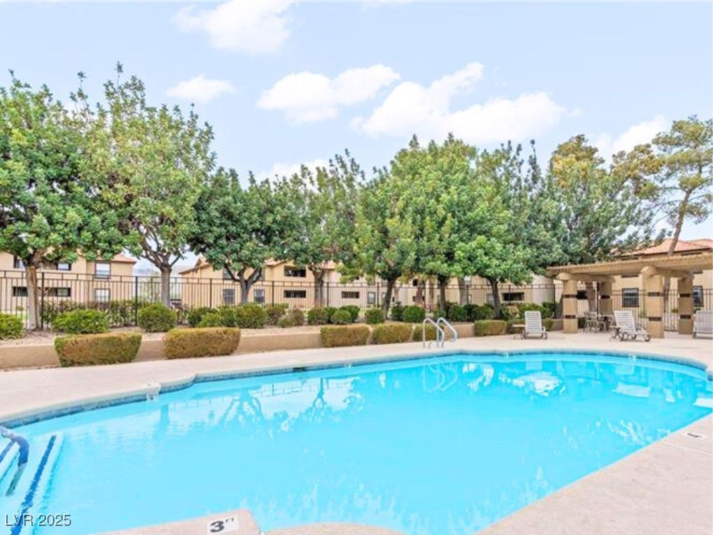 2451 North Rainbow Boulevard, Unit 1130 Las Vegas, NV 89108 - Photo 20 of 21 Community pool featuring a patio area