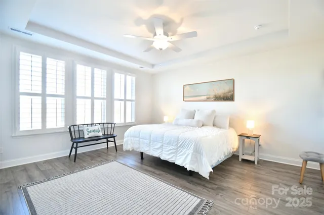 a bedroom with a bed a large bed and a couch