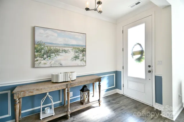 a view of workspace with wooden floor entryway
