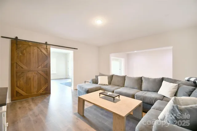 a living room with furniture and a rug