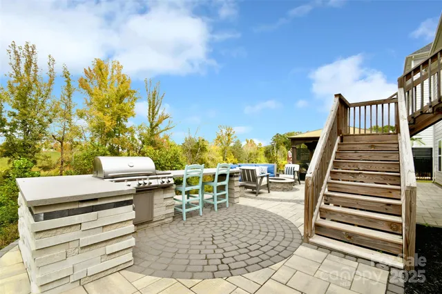 a view of a chairs and table in patio