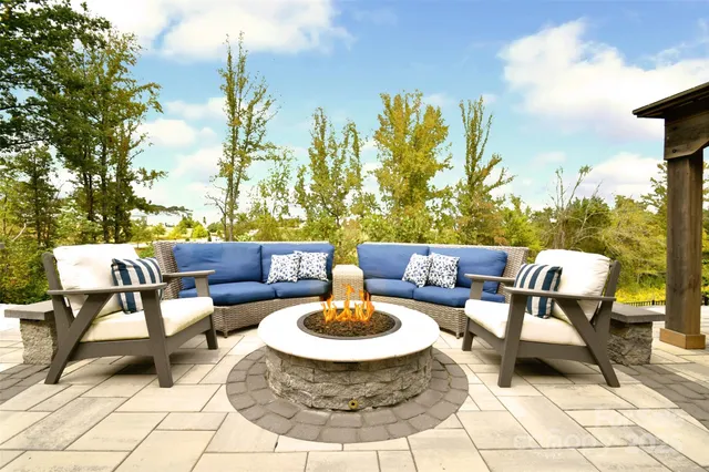 a outdoor living space with furniture and a rug