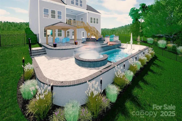 an aerial view of a house with outdoor space and trees all around