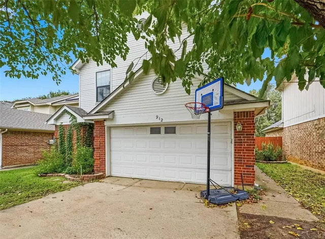 a house that has a tree in front of the house