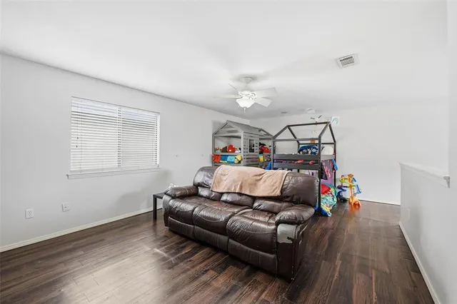 a bed room with furniture and a window