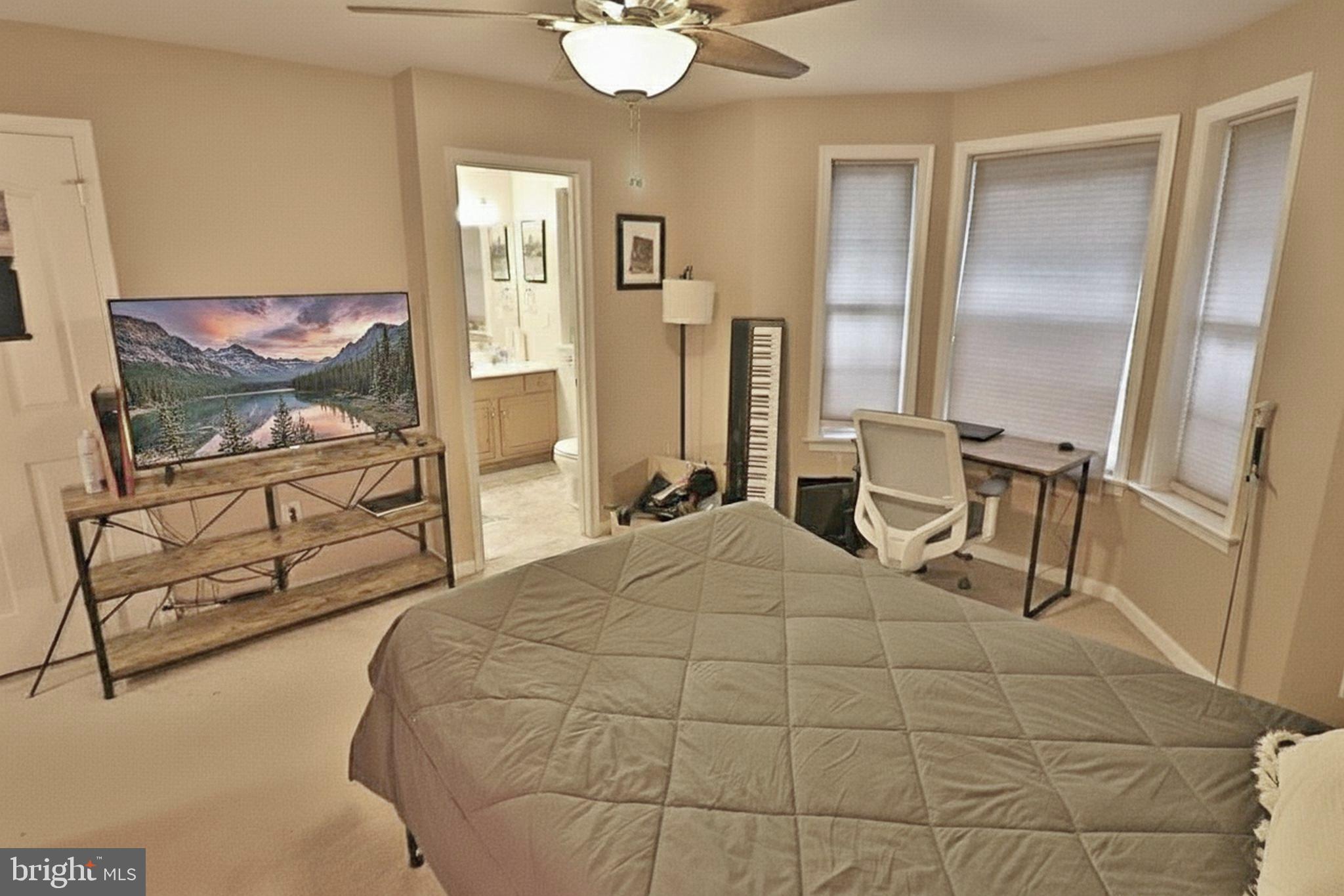 486 Balmer Road Lititz, PA 17543 - Photo 20 of 31 a bedroom with a bed a flat screen tv and wall