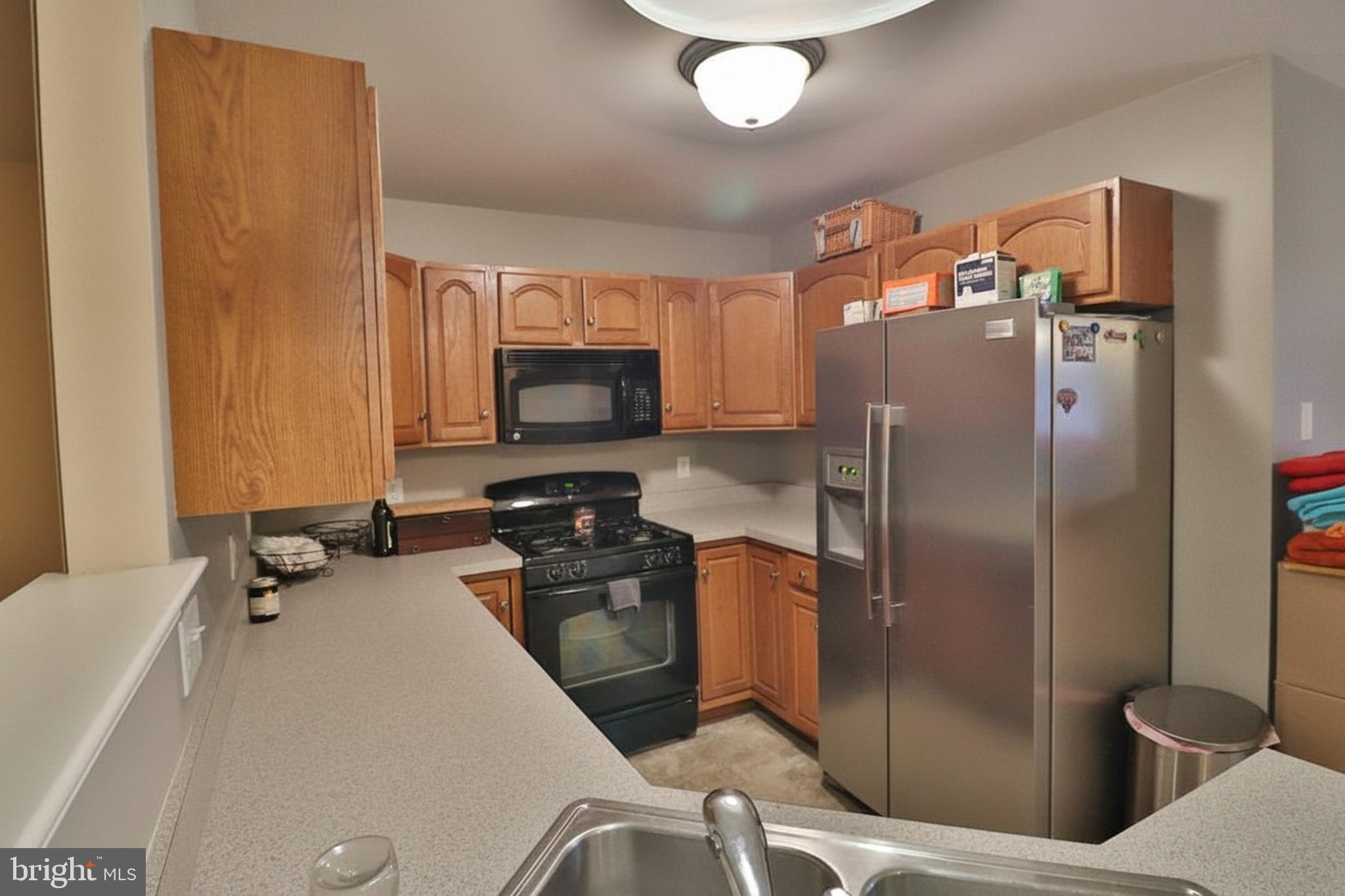486 Balmer Road Lititz, PA 17543 - Photo 4 of 31 a kitchen with a refrigerator and a sink