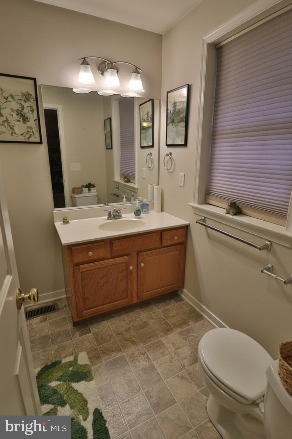 486 Balmer Road Lititz, PA 17543 - Photo 9 of 31 a bathroom with a toilet sink and mirror