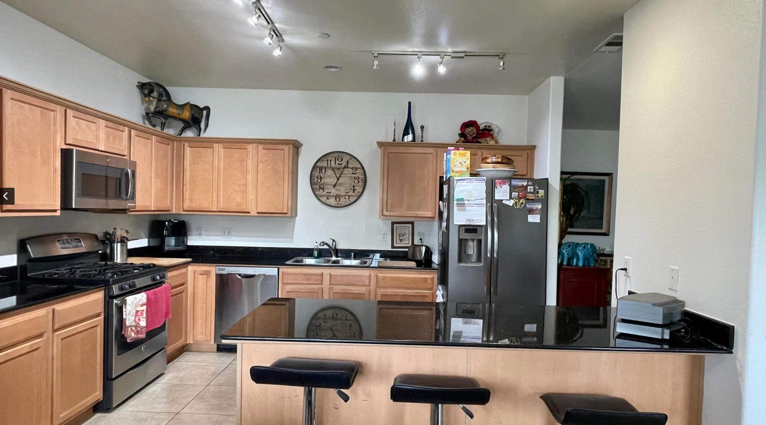 67694 Duke Road, Unit 104 Cathedral City, CA 92234 - Photo 2 of 16 a kitchen with stainless steel appliances granite countertop a stove and cabinets
