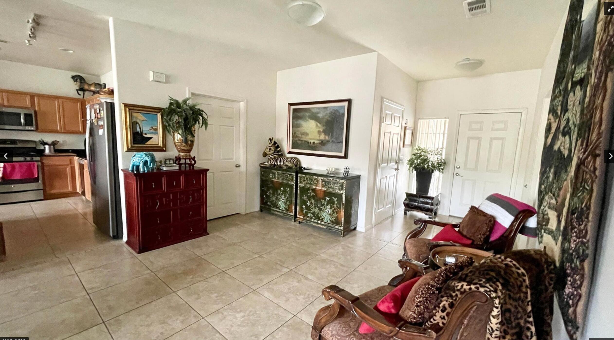 67694 Duke Road, Unit 104 Cathedral City, CA 92234 - Photo 7 of 16 a living room with furniture and a flat screen tv