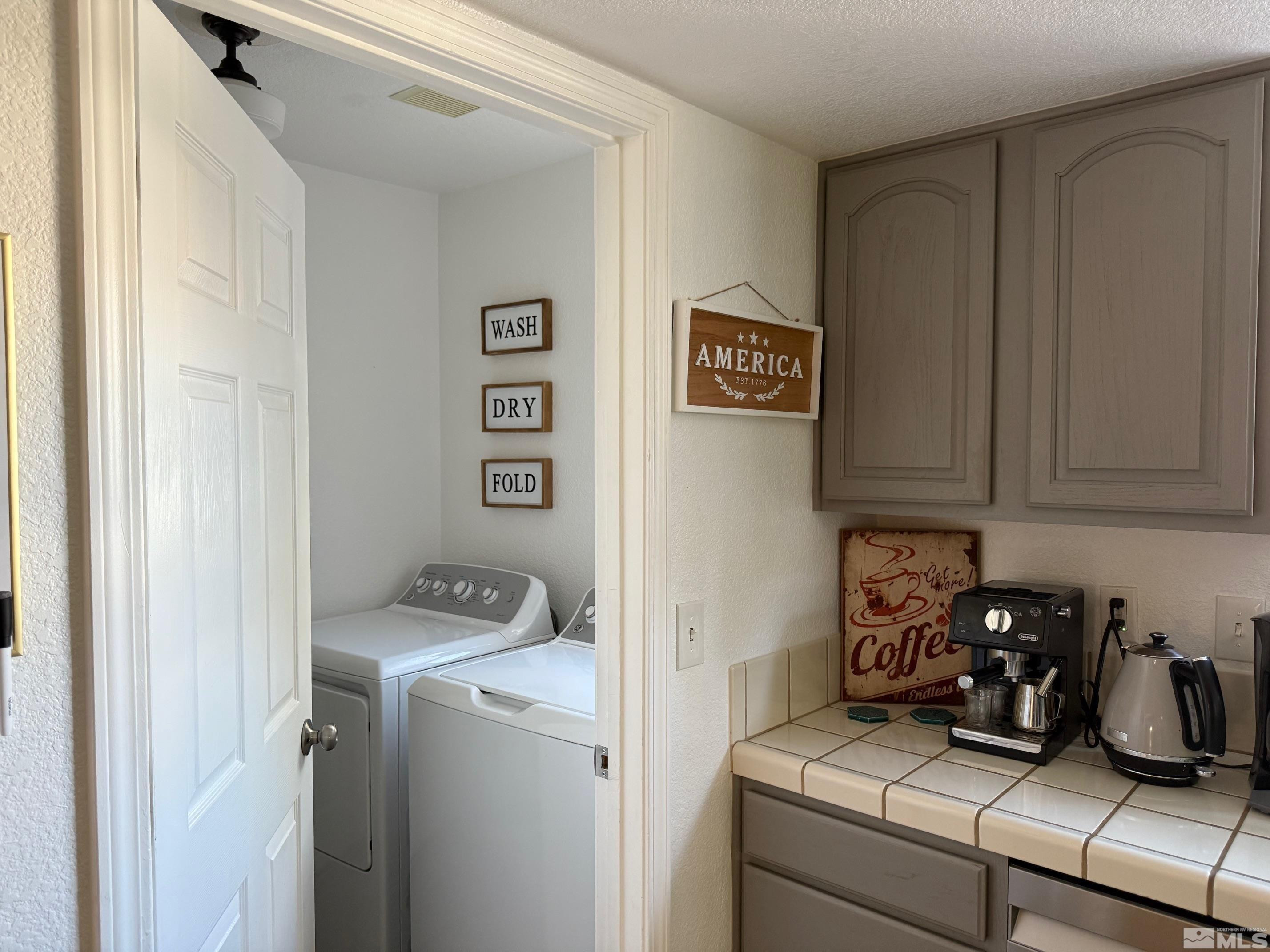 980 Sunview Drive Carson City, NV 89705 - Photo 12 of 27 a view of storage and utility room with washer and dryer
