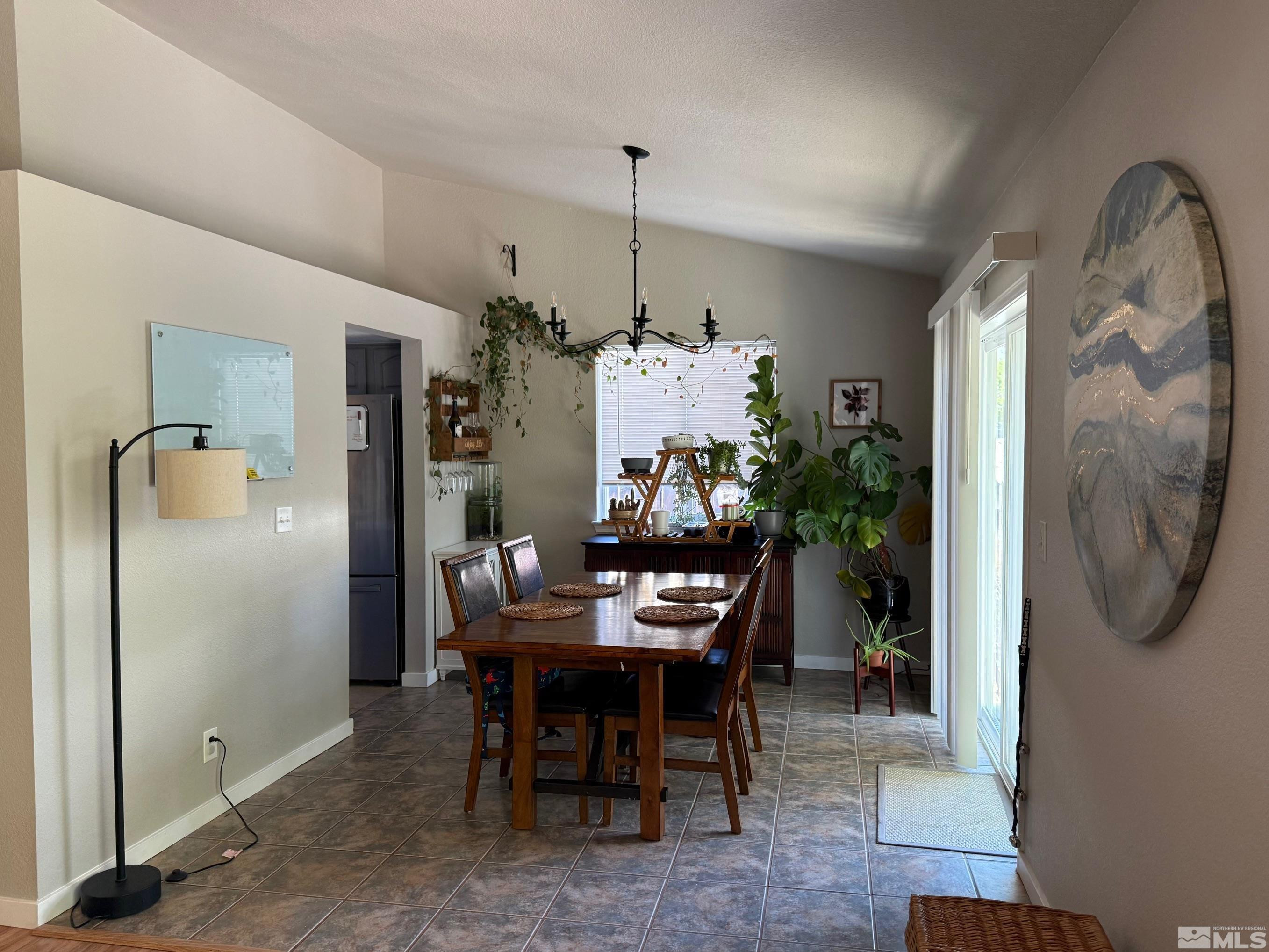 980 Sunview Drive Carson City, NV 89705 - Photo 13 of 27 a dining room with furniture and a chandelier