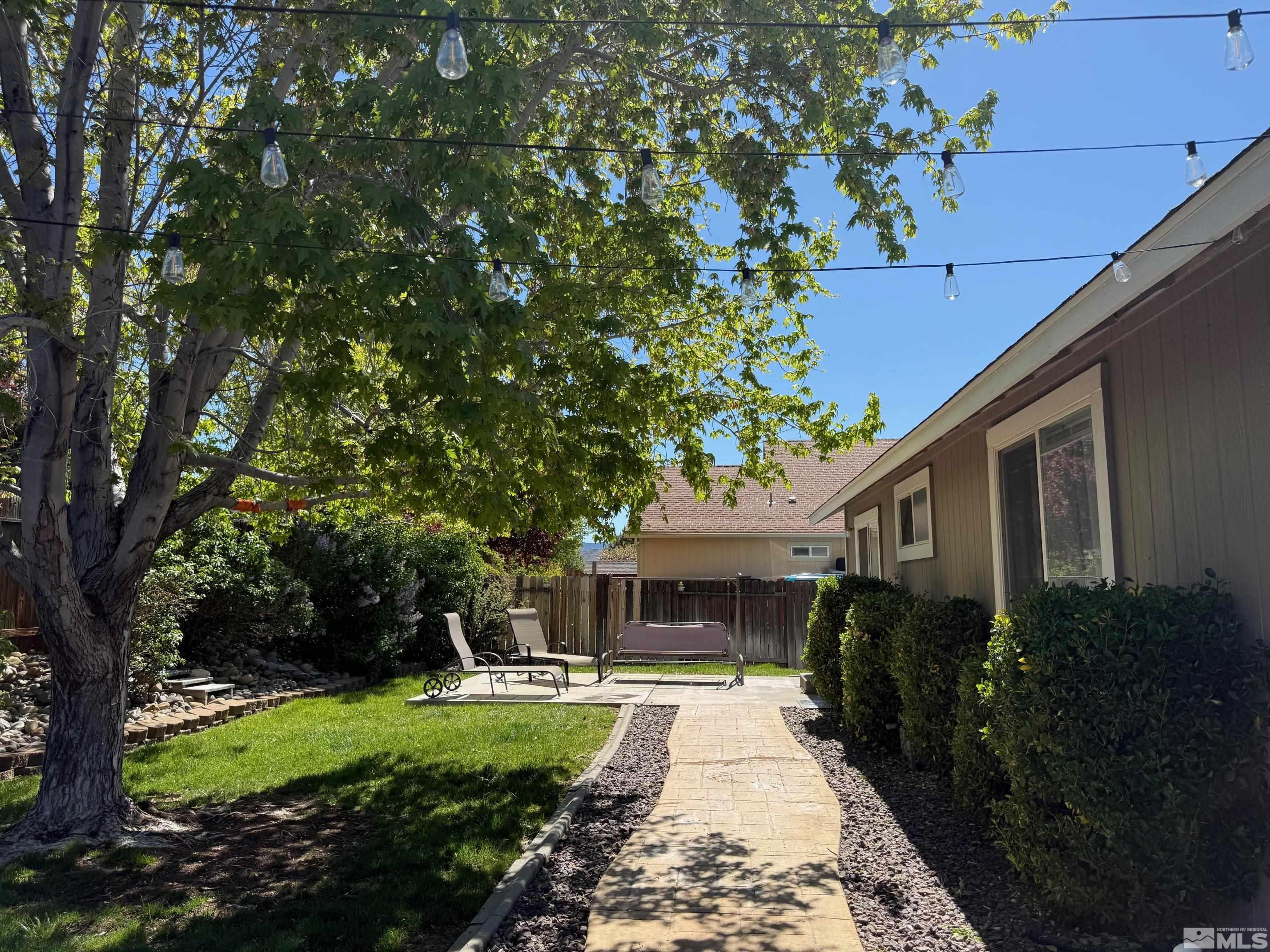 980 Sunview Drive Carson City, NV 89705 - Photo 20 of 27 a front view of a house with garden