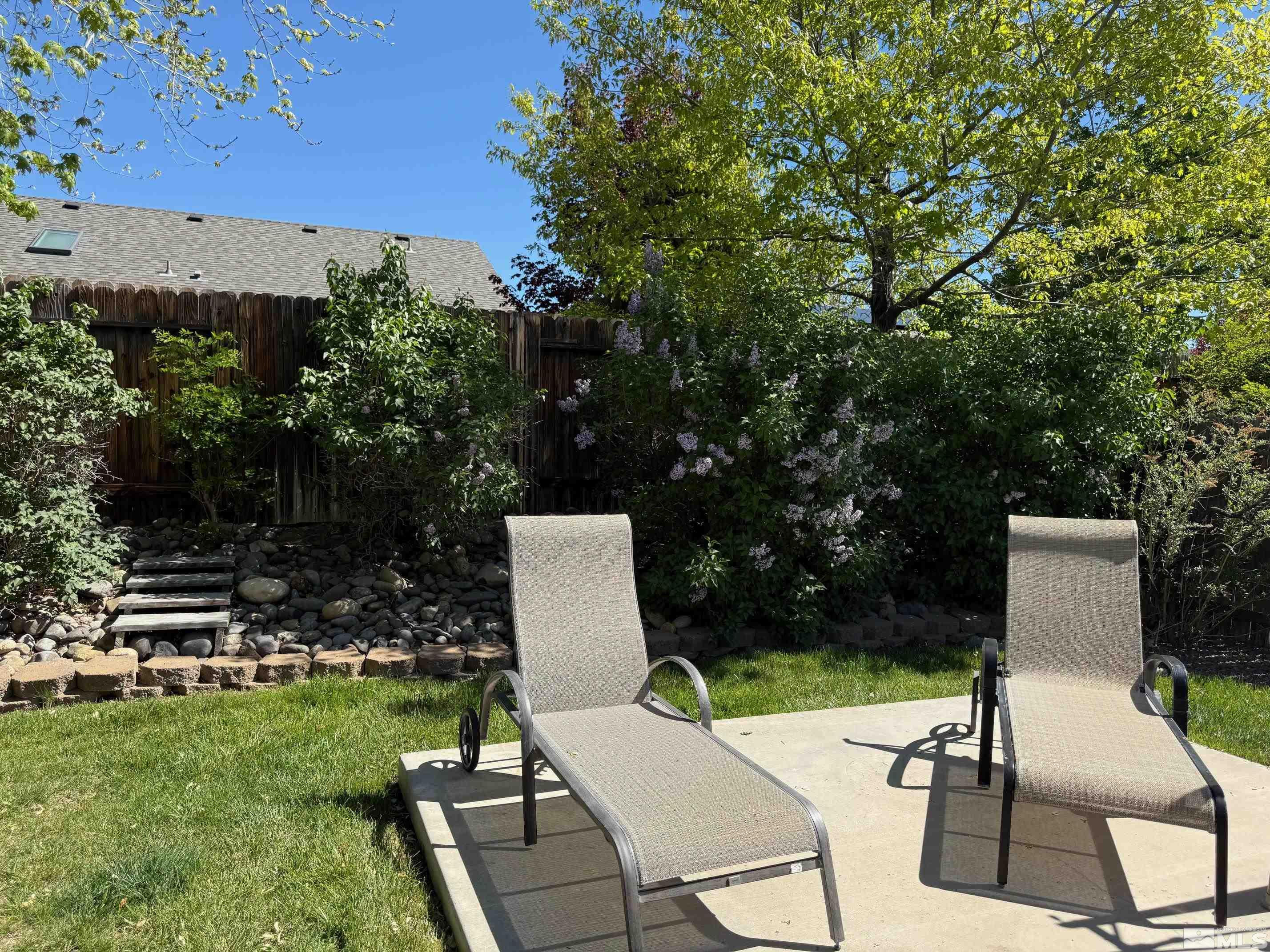 980 Sunview Drive Carson City, NV 89705 - Photo 23 of 27 a view of backyard with seating area and green space