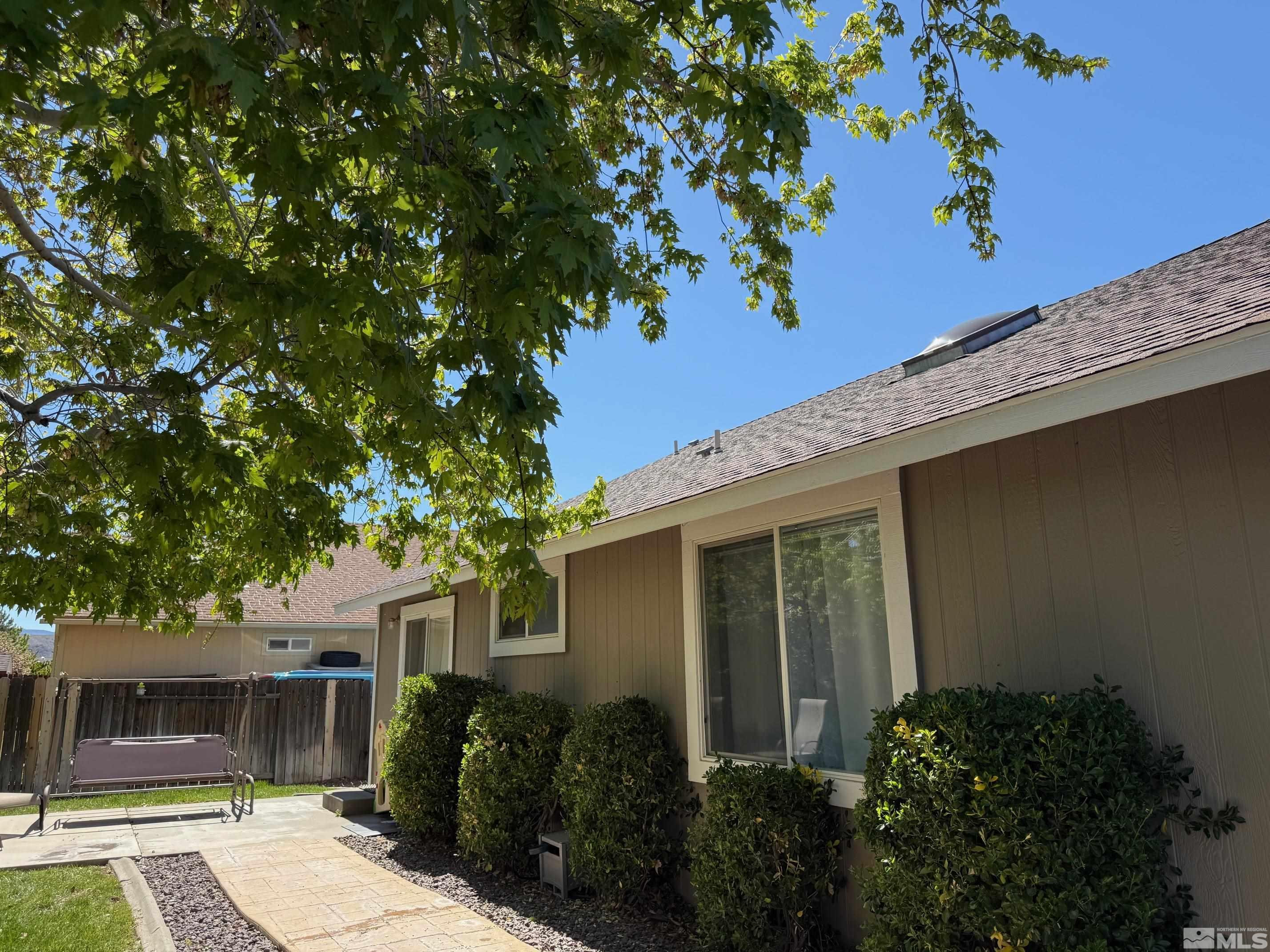 980 Sunview Drive Carson City, NV 89705 - Photo 25 of 27 front view of a house with a tree