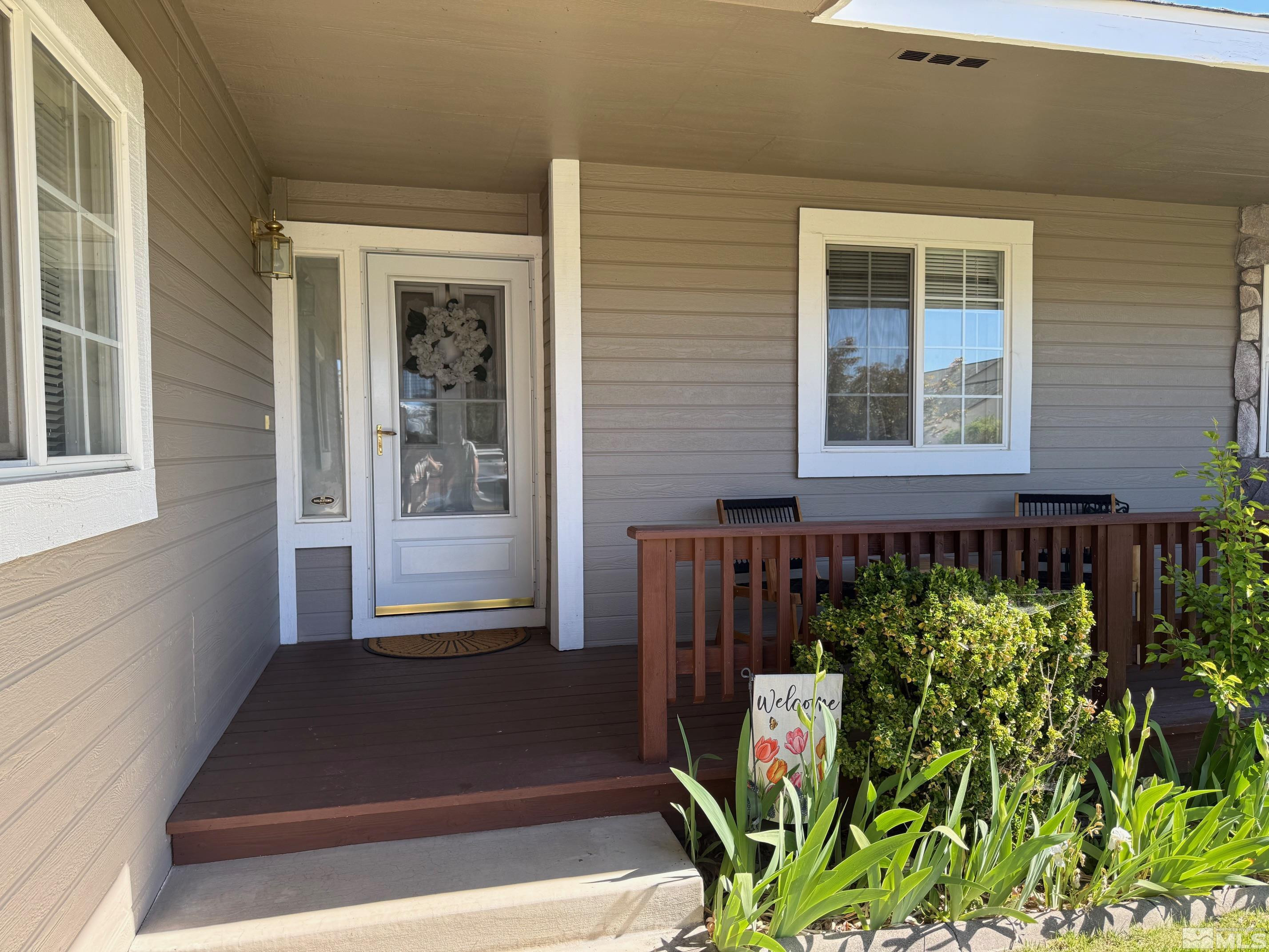980 Sunview Drive Carson City, NV 89705 - Photo 4 of 27 a front view of a house with a yard