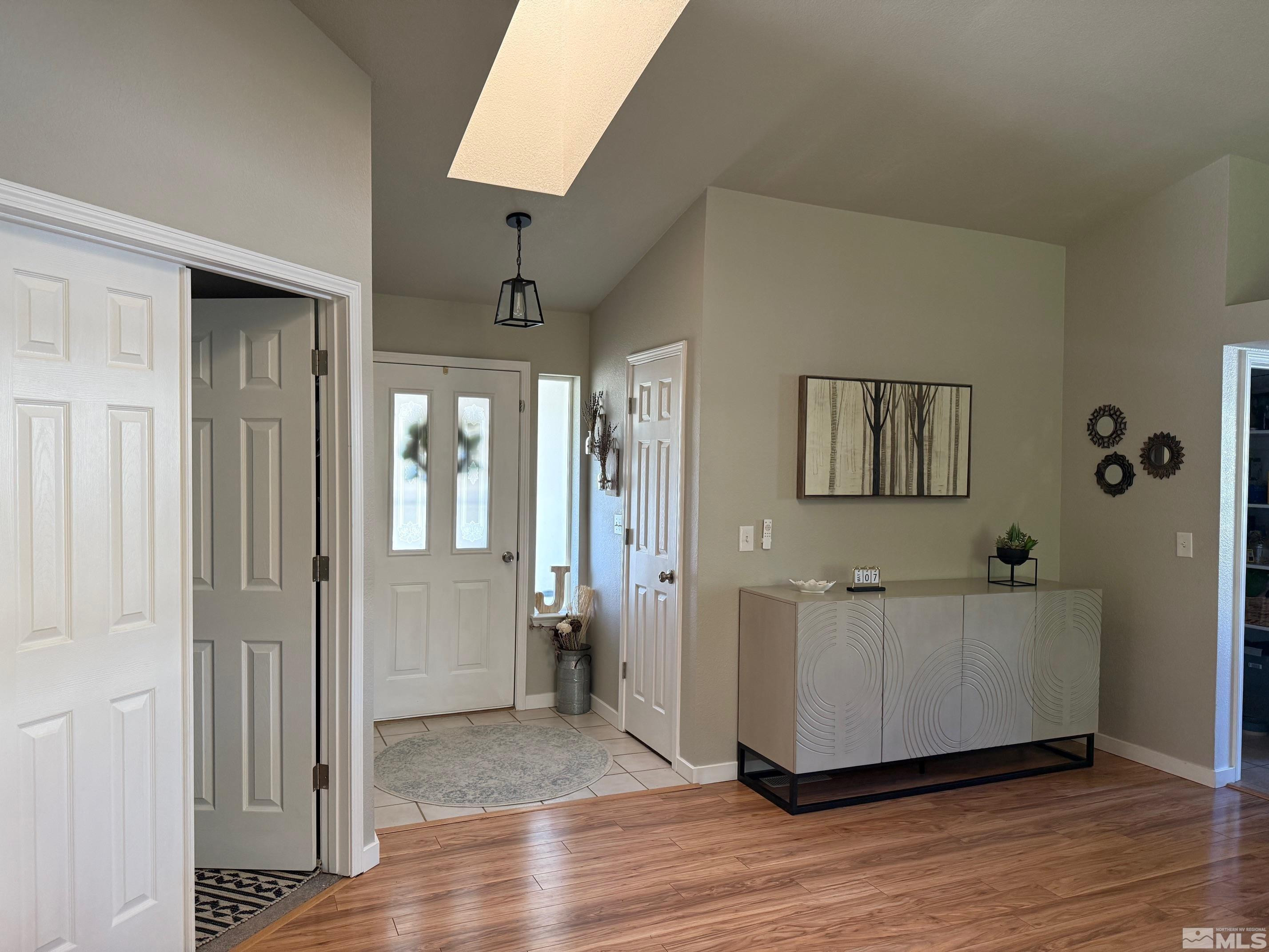 980 Sunview Drive Carson City, NV 89705 - Photo 5 of 27 a view of a hallway with wooden floor and a cabinet