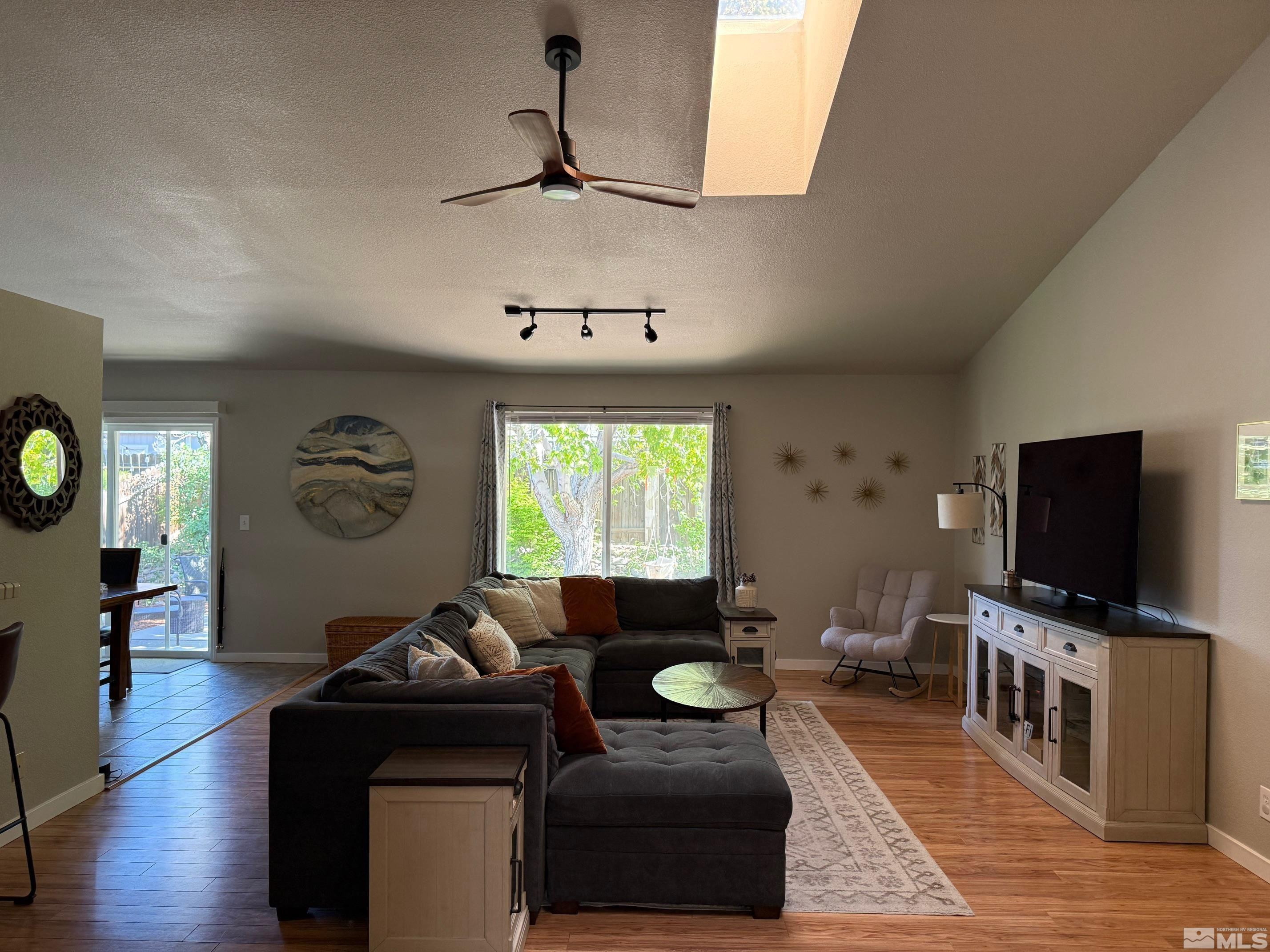 980 Sunview Drive Carson City, NV 89705 - Photo 6 of 27 a living room with furniture and a flat screen tv