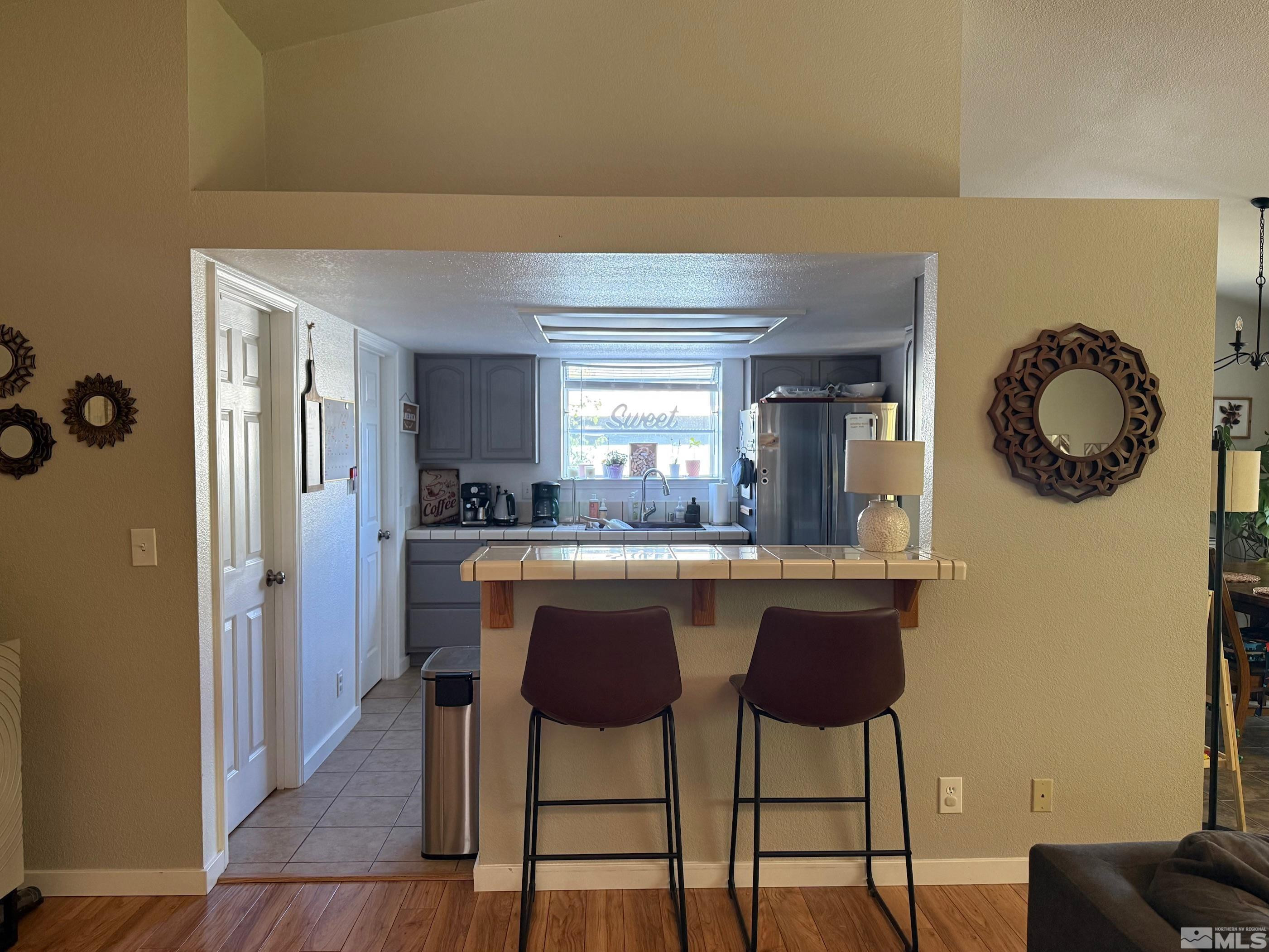 980 Sunview Drive Carson City, NV 89705 - Photo 9 of 27 a kitchen with a table and chairs in it