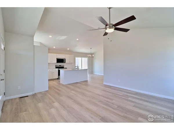 a view of a kitchen with wooden floor