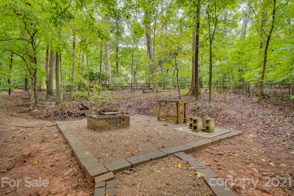 833 Amanda Drive Matthews, NC 28104 - Photo 11 of 48 a view of a backyard with sitting area