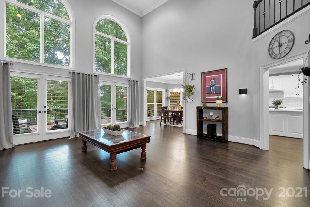 833 Amanda Drive Matthews, NC 28104 - Photo 13 of 48 a living room with furniture and large windows