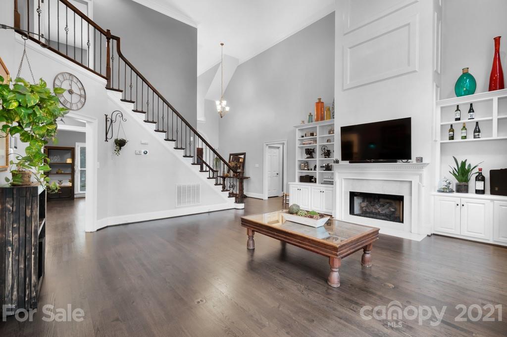 833 Amanda Drive Matthews, NC 28104 - Photo 15 of 48 a living room with furniture a fireplace and a flat screen tv
