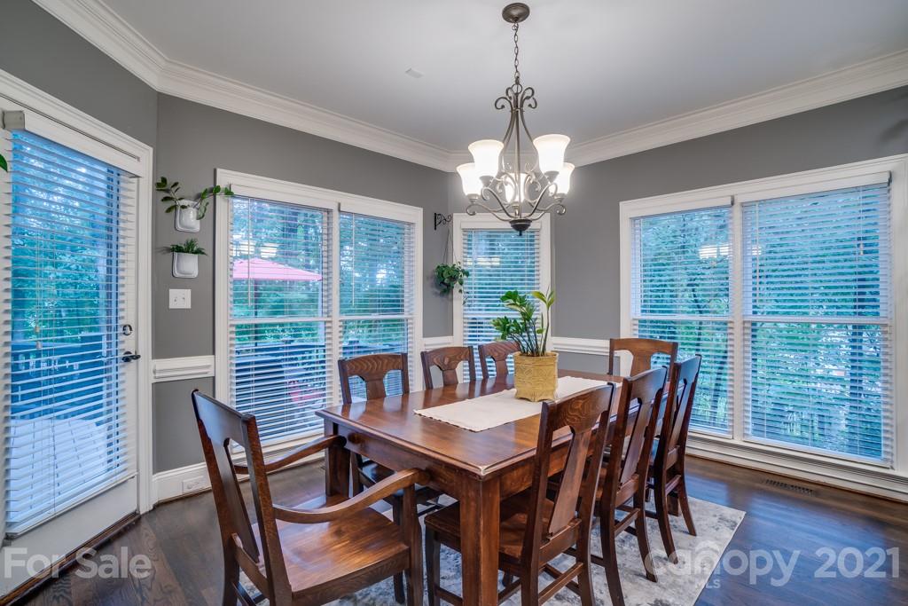 833 Amanda Drive Matthews, NC 28104 - Photo 17 of 48 a view of a dining room with furniture window and wooden floor