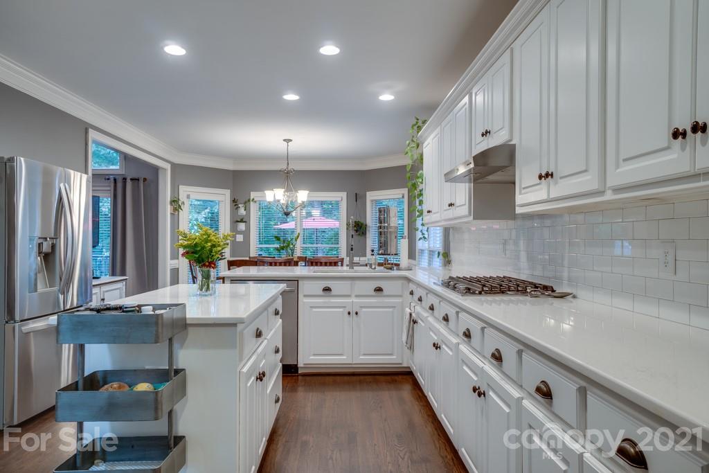 833 Amanda Drive Matthews, NC 28104 - Photo 21 of 48 a kitchen with a sink stove and cabinets