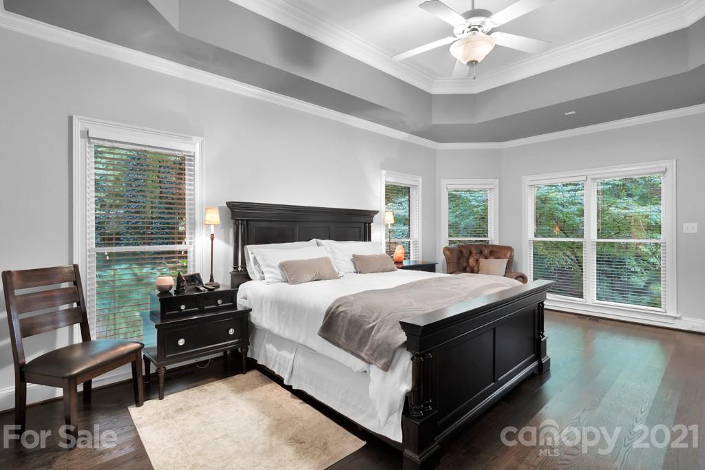 833 Amanda Drive Matthews, NC 28104 - Photo 27 of 48 a bedroom with a bed a couch and large window