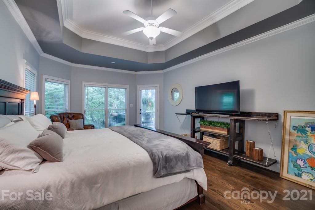 833 Amanda Drive Matthews, NC 28104 - Photo 28 of 48 a bedroom with a bed and a flat screen tv