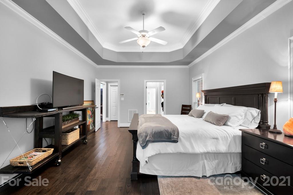 833 Amanda Drive Matthews, NC 28104 - Photo 30 of 48 a bedroom with a bed and a flat screen tv