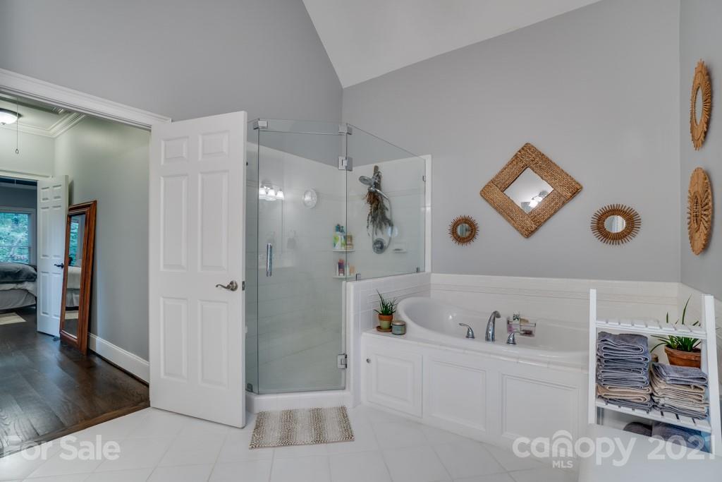 833 Amanda Drive Matthews, NC 28104 - Photo 34 of 48 a bathroom with a bathtub and a shower