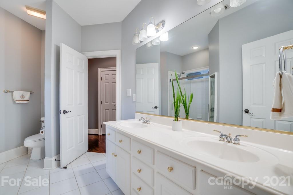 833 Amanda Drive Matthews, NC 28104 - Photo 39 of 48 a bathroom with a double vanity sink mirror and toilet