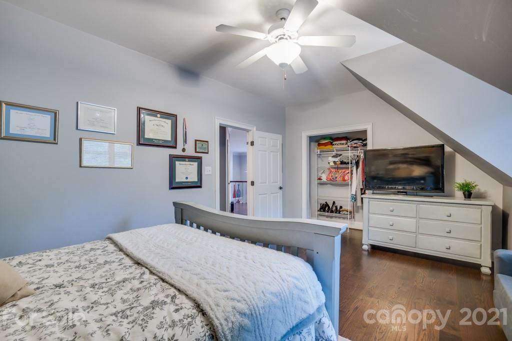 833 Amanda Drive Matthews, NC 28104 - Photo 42 of 48 a bedroom with a bed and a flat screen tv