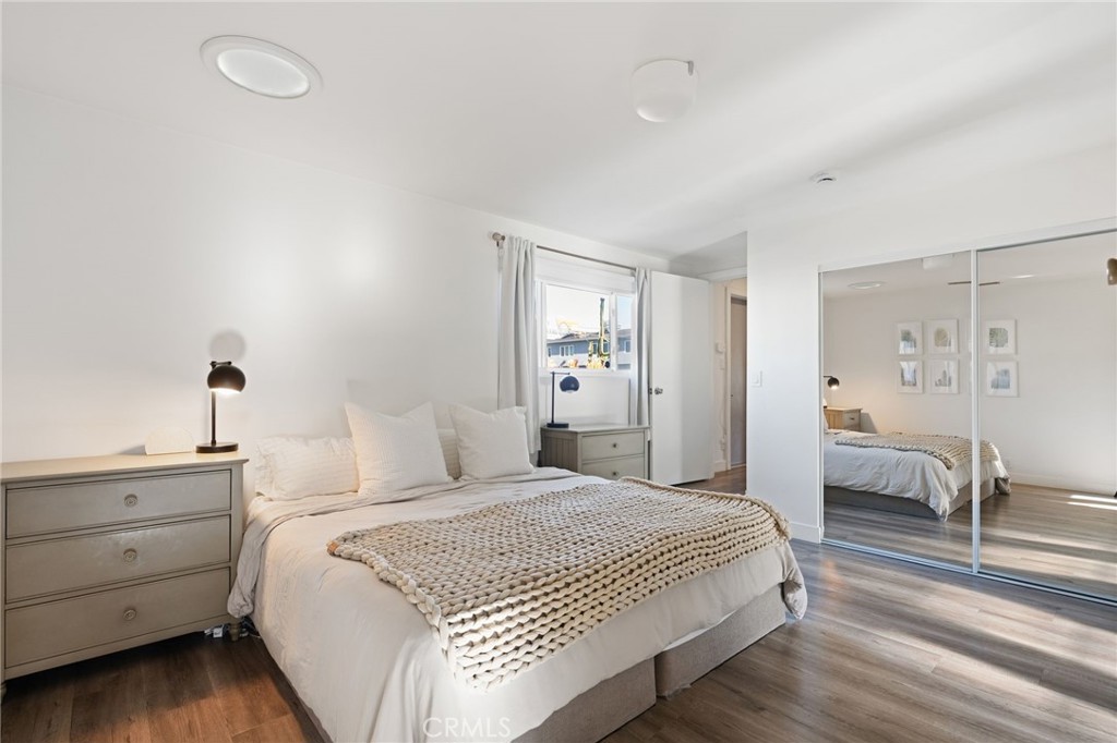 7901 Flight Los Angeles, CA 90045 - Photo 11 of 24 a spacious bedroom with a bed and a table