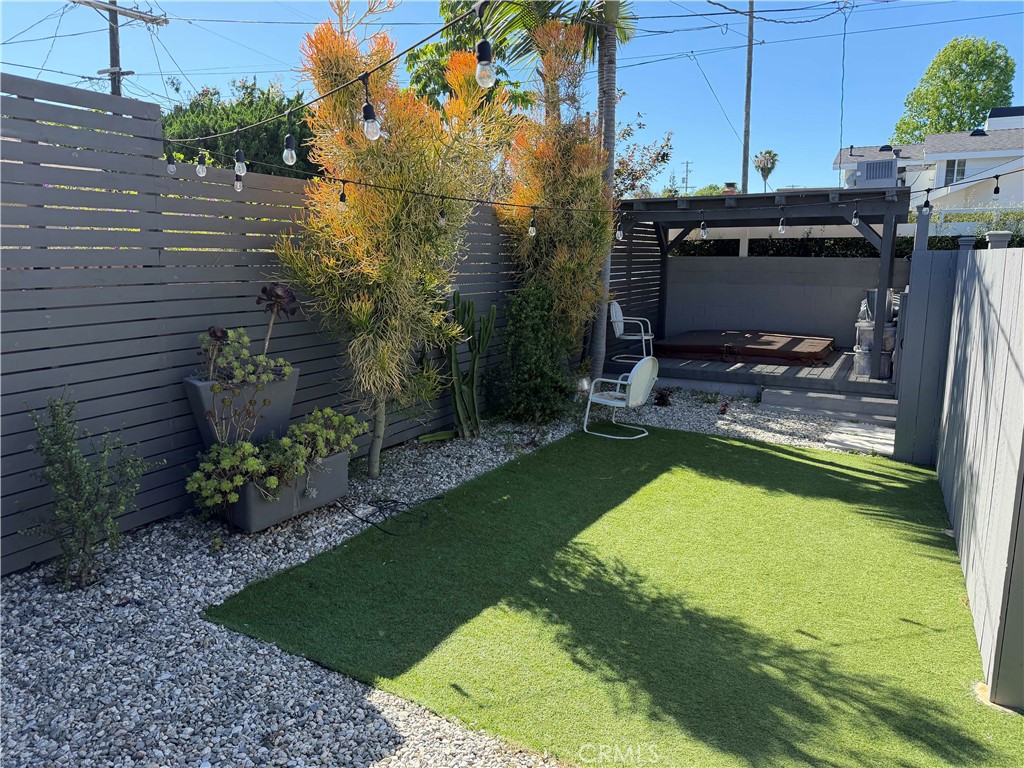 7901 Flight Los Angeles, CA 90045 - Photo 21 of 24 a view of a backyard with plants and a patio